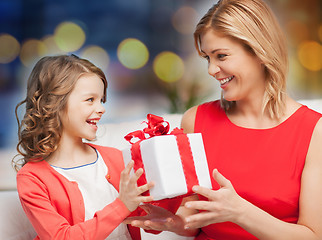 Image showing happy mother and daughter with gift box