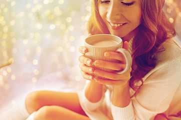 Image showing close up of happy woman with cocoa cup at home