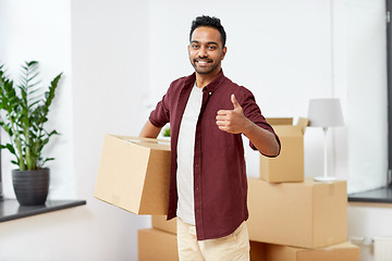 Image showing man with box moving to new home showing thumbs up