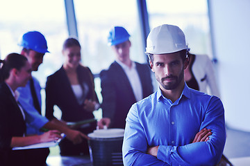 Image showing business people and engineers on meeting