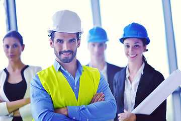 Image showing business people and construction engineers on meeting