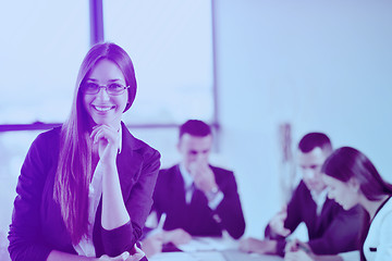 Image showing business woman with her staff in background at office