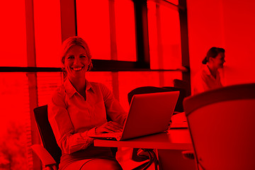 Image showing business woman with her staff in background at office