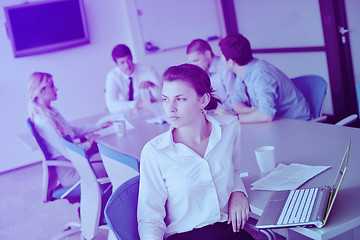 Image showing business woman with her staff in background at office