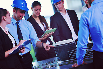 Image showing business people and engineers on meeting