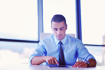 Image showing business man using tablet compuer at office