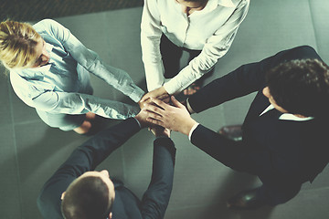 Image showing business people group joining hands