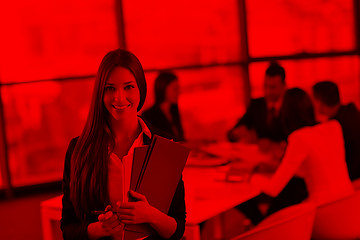 Image showing business woman with her staff in background at office