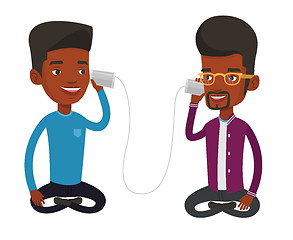 Image showing Young friends talking through tin phone.