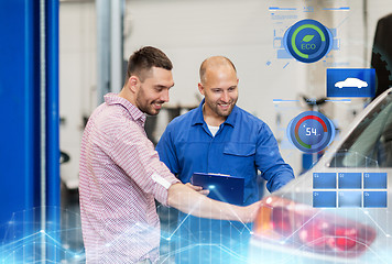 Image showing auto mechanic with clipboard and man at car shop