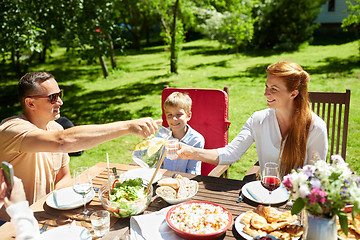 Image showing happy family having dinner or summer garden party