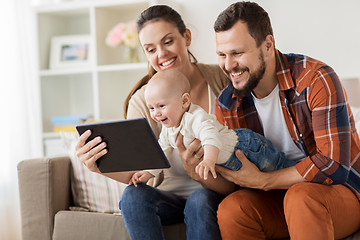 Image showing mother, father and baby with tablet pc at home