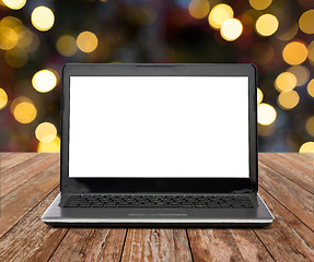 Image showing laptop with white screen over christmas lights