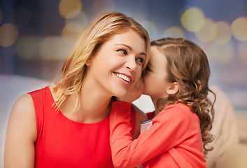 Image showing happy mother and girl whispering into ear