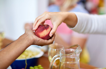 Image showing multiracial couple hands with peach