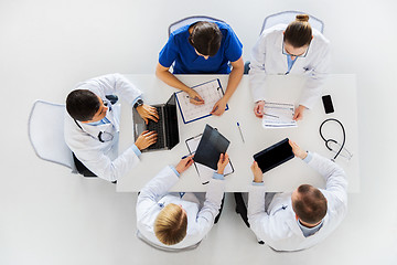 Image showing doctors with x-ray and cardiogram at hospital