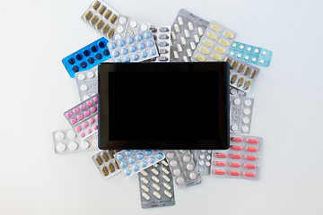 Image showing tablet pc with pills and capsules of drugs