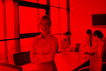 Image showing business woman with her staff in background at office