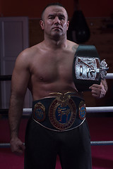 Image showing kick boxer with his championship belt