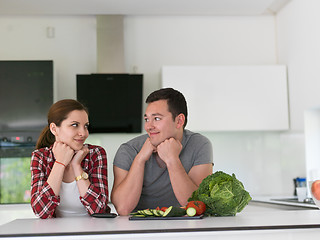 Image showing Young couple in the kitchen