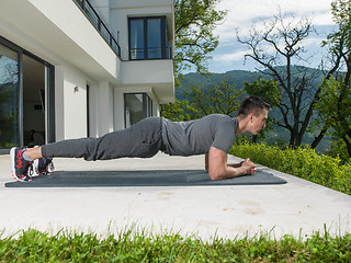 Image showing man doing morning yoga exercises