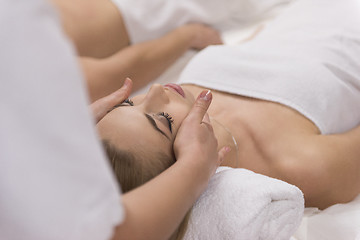 Image showing woman receiving a head massage