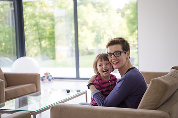 Image showing mother and cute little girl enjoying their free time