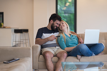 Image showing young happy couple relaxes in the living room