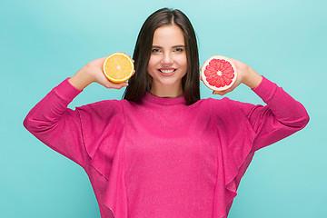 Image showing Beautiful woman\'s face with juicy orange