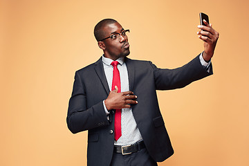 Image showing Young african business man on the phone