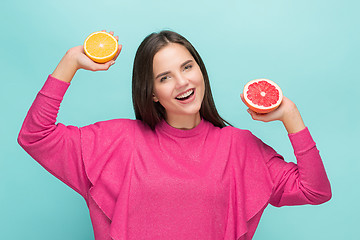 Image showing Beautiful woman\'s face with juicy orange