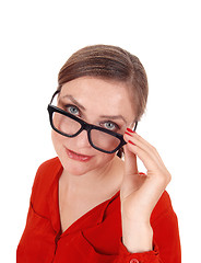 Image showing Troubled  young woman with glasses