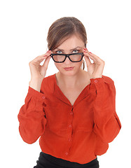 Image showing Woman looking over her glasses