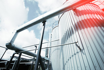 Image showing Industrial zone, Steel pipelines and valves against blue sky