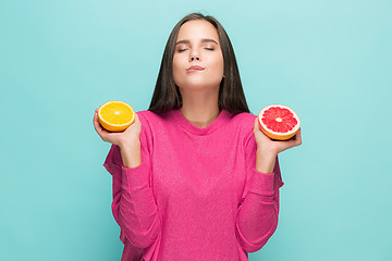 Image showing Beautiful woman\'s face with juicy orange