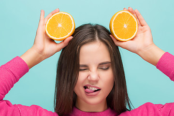 Image showing Beautiful woman\'s face with juicy orange