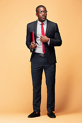 Image showing Handsome Afro American man standing with a laptop