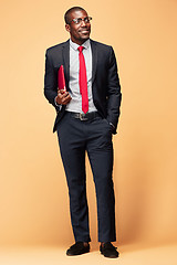 Image showing Handsome Afro American man standing with a laptop