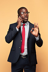 Image showing Young african business man on the phone