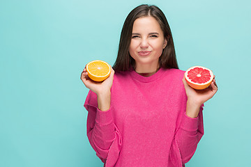 Image showing Beautiful woman\'s face with juicy orange