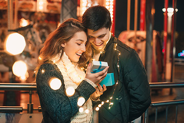 Image showing romantic surprise for Christmas, woman receives a gift from her boyfriend