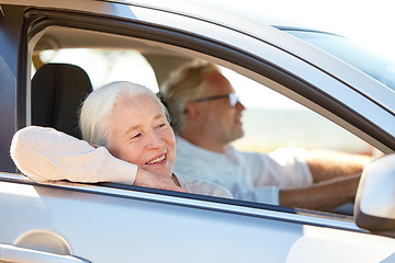 Image showing happy senior couple driving in car