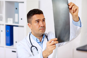 Image showing male doctor or surgeon with x-ray at hospital