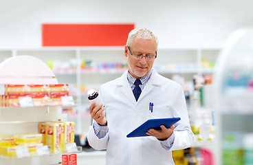 Image showing senior with tablet pc at pharmacy