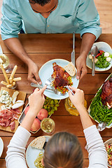 Image showing group of people eating chicken for dinner