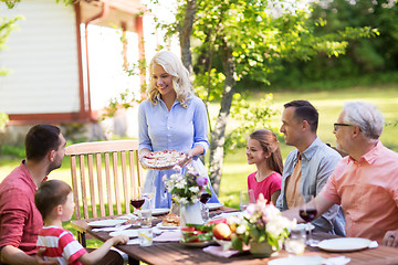 Image showing happy family having dinner or summer garden party