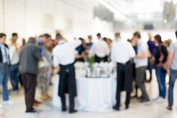 Image showing Blured image of businesspeople at coffee break at conference meeting.