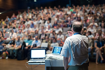 Image showing Public speaker giving talk at Business Event.