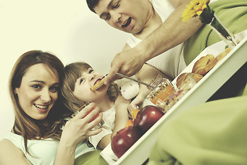 Image showing happy young family eat breakfast in bed