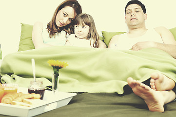 Image showing happy young family eat breakfast in bed